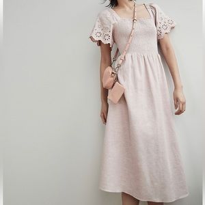 Super sweet pastel pink dress, eyelet sleeves, smocked.